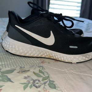 Used nike revolution running shoes